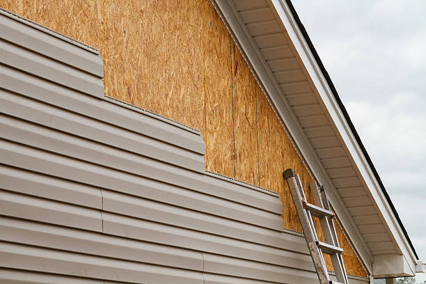 Professional Emergency Siding Repair technician working in Woolford, MD